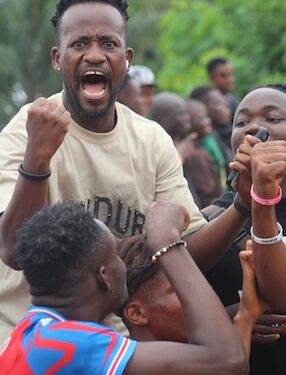 Fans celebrate passionately during a Z-Billion Allstar Tournament match in Paynesville, Liberia — a grassroots football event keeping the sport alive in the off-season.