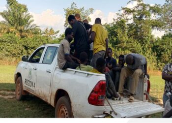 FDA patrol vehicle carrying arrested Burkinabé cocoa farmers suspected of clearing protected forestland in Grand Gedeh County