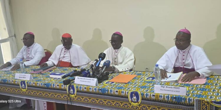 Four senior Catholic bishops of Côte d’Ivoire seated at a press conference table in Abidjan, delivering a pastoral letter on electoral reform ahead of the 2025 presidential election.