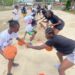 Young Liberian girls practice basketball drills during the Flames Basketball youth camp in Monrovia, guided by FIBA-certified coaches.