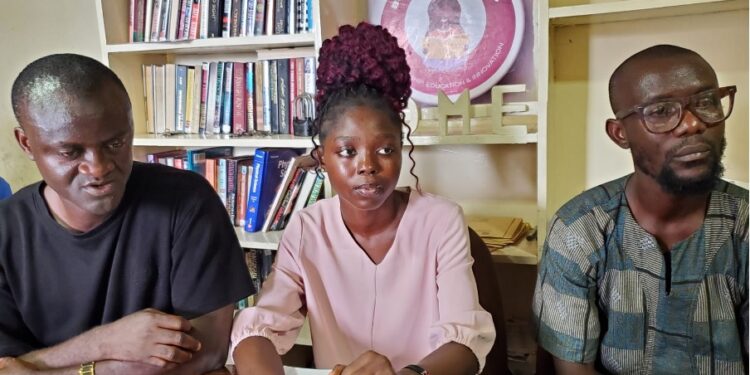 Civil society and student group representatives, including Books Before Boys, address the press in Monrovia following President Boakai’s veto of the Port Decentralization Act.