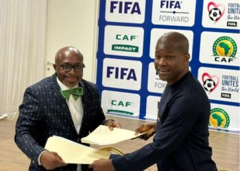 Tubman University President Dr. Olu Q. Menjay and LFA President Mustapha Raji sign agreement launching Liberia’s first football coaching diploma program.