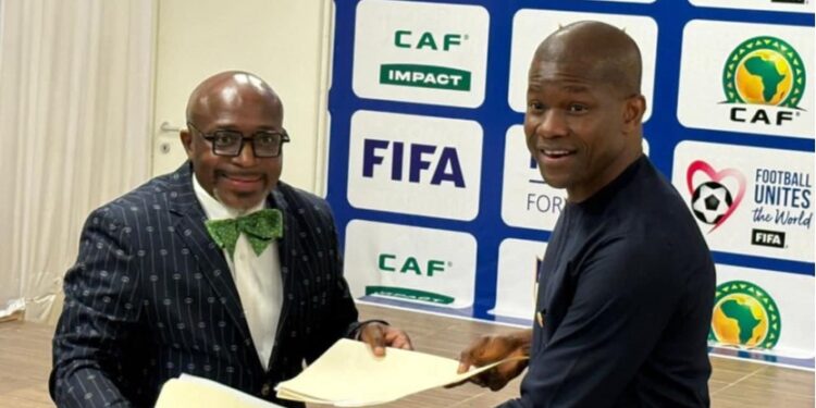 Tubman University President Dr. Olu Q. Menjay and LFA President Mustapha Raji sign agreement launching Liberia’s first football coaching diploma program.