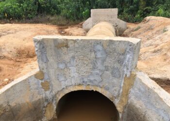 A newly constructed concrete culvert in Pleebo, Maryland County, designed to reduce flooding and improve drainage along key community roads.