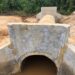A newly constructed concrete culvert in Pleebo, Maryland County, designed to reduce flooding and improve drainage along key community roads.