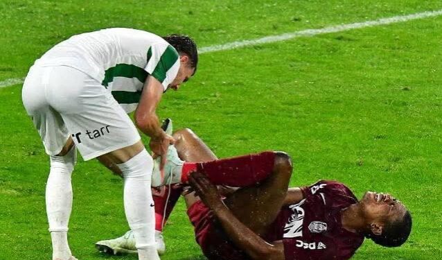 Liberian striker Mohammed Kamara grimaces in pain on the pitch after suffering a suspected fibula fracture during CFR Cluj’s match against Paksi in the Romanian top flight.