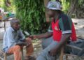 Jefferson Togbah Mansah interviews a rural farmer as LAEJN marks 10 years of advancing agriculture journalism and farmer-focused media in Liberia.