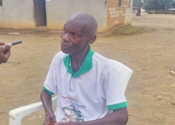 Elderly man being interviewed about Gbarney Public School’s challenges in Bong County, Liberia.