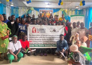 Group photo of AFELL, Clooney Foundation representatives, and West Point residents during a community outreach on drug abuse and domestic violence in Monrovia.