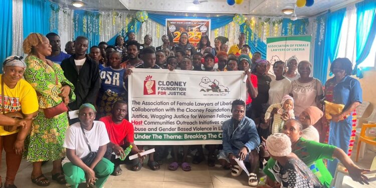 Group photo of AFELL, Clooney Foundation representatives, and West Point residents during a community outreach on drug abuse and domestic violence in Monrovia.