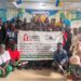 Group photo of AFELL members, Clooney Foundation partners, and West Point residents during a legal awareness and anti-drug outreach session in Monrovia.