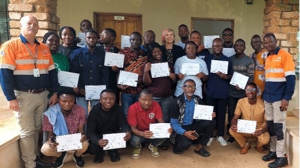 Group photo of participants and staff from ArcelorMittal Liberia Training Academy and African Bible College University after teacher training completion