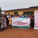 Group photo of participants at ActionAid Liberia’s County-Level National People’s Summit on Climate Justice in Bong County, holding a banner promoting agroecology, people-driven climate finance, and sustainable solutions for Liberia.