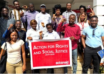 Group photo of ActionAid Liberia staff and youth-led organizations holding a banner for the Youth AHEAD Project launch focused on rights and social justice.