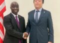 Agriculture Minister Dr. Alexander Nuetah shakes hands with Mainland Group CEO Zhu Chen during announcement of $100M Liberia agriculture investment.
