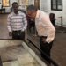 Prof. Dr. Khaled El-Enany tours the National Museum of Liberia with a guide, viewing historical documents during his UNESCO campaign visit.