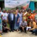 Participants at Liberia’s AICA launch under banner reading ‘Alliance for Indigenous Peoples and Local Communities for Conservation in Africa.’