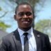 Blamo N. Toe, LEGISPOOL presidential aspirant, pictured in a black suit and tie, smiling during the launch of his ELEVATE platform for press reform.