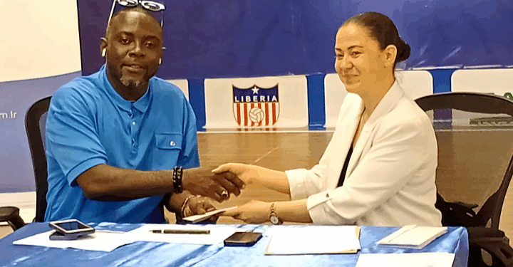 Borough FC President Sylvanus Morris with Liberia Football Association partner during Bettomax Champions Cup launch in Monrovia.