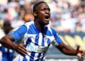 Christian Saydee celebrates scoring his first goal for Wigan Athletic in a 2-0 victory over Peterborough United.