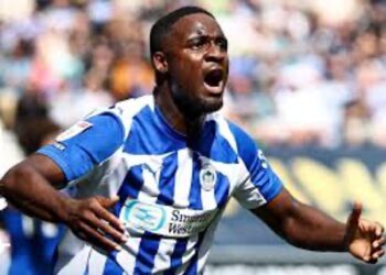 Christian Saydee celebrates scoring his first goal for Wigan Athletic in a 2-0 victory over Peterborough United.