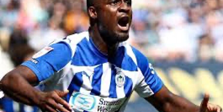 Christian Saydee celebrates scoring his first goal for Wigan Athletic in a 2-0 victory over Peterborough United.