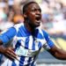 Christian Saydee celebrates scoring his first goal for Wigan Athletic in a 2-0 victory over Peterborough United.