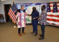 Outgoing U.S. Ambassador Mark Toner receiving a traditional Liberian gown from OK FM Manager Clarence Jackson and Editor Trokon Wrepue during a farewell ceremony at the U.S. Embassy in Monrovia.