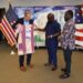 Outgoing U.S. Ambassador Mark Toner receiving a traditional Liberian gown from OK FM Manager Clarence Jackson and Editor Trokon Wrepue during a farewell ceremony at the U.S. Embassy in Monrovia.