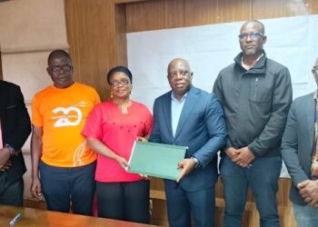 Officials from the Ministry of Health, NAHWUL, and Ecobank Liberia pose after signing a landmark MOU to improve financial access for Liberian health workers.