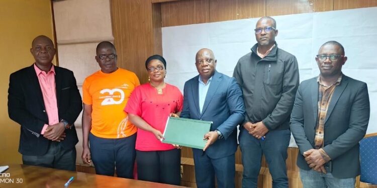 Officials from the Ministry of Health, NAHWUL, and Ecobank Liberia pose after signing a landmark MOU to improve financial access for Liberian health workers.