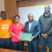 Officials from the Ministry of Health, NAHWUL, and Ecobank Liberia pose after signing a landmark MOU to improve financial access for Liberian health workers.