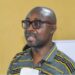 Eddie D. Jarwolo, Executive Director of Naymote, addresses participants during a presentation on equitable county development funding in Liberia.