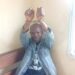 Liberian journalist Eric Opa Doue in handcuffs raising his hands, following a second attempted arrest in River Cess County