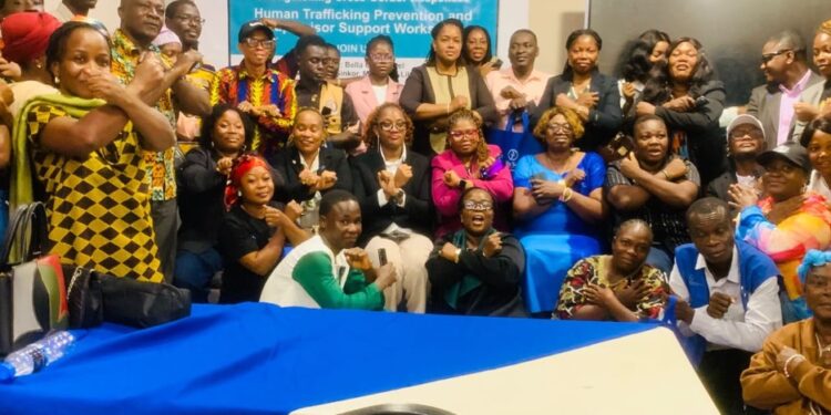 Participants pose at a human trafficking workshop in Monrovia, hosted by Family Service Liberia and the Bliss Foundation, advocating for a national Anti-Trafficking Day on January 11.