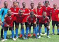 First Touch Sports Academy U-17 team poses in red and blue jerseys on the football pitch ahead of Liberia's national “Say No to Drugs” campaign launch.