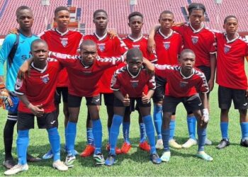 First Touch Sports Academy U-17 team poses in red and blue jerseys on the football pitch ahead of Liberia's national “Say No to Drugs” campaign launch.