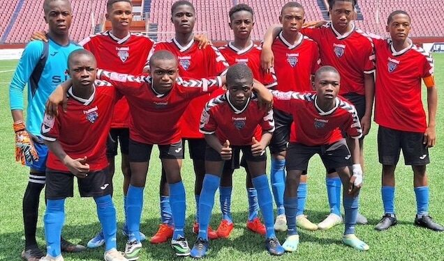 First Touch Sports Academy U-17 team poses in red and blue jerseys on the football pitch ahead of Liberia's national “Say No to Drugs” campaign launch.