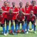 First Touch Sports Academy U-17 team poses in red and blue jerseys on the football pitch ahead of Liberia's national “Say No to Drugs” campaign launch.