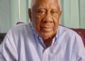 Former Liberian Finance Minister David M. Farhart seated in his Monrovia office during interview on Roye Building renovation