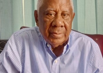 Former Liberian Finance Minister David M. Farhart seated in his Monrovia office during interview on Roye Building renovation