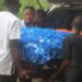 Pallbearers carry the flower-covered casket of Liberia U-20 footballer Gabrielle Sabina Lines during her funeral in Cotton Tree, Margibi County.
