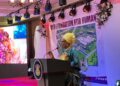 First lady Kartumu Boakai speaking into the microphone