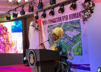 First lady Kartumu Boakai speaking into the microphone
