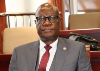Sen. Samuel G. Kogar sits in the Liberian Senate during a session at Capitol Building.
