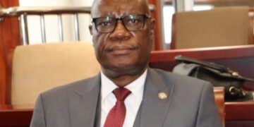 Sen. Samuel G. Kogar sits in the Liberian Senate during a session at Capitol Building.