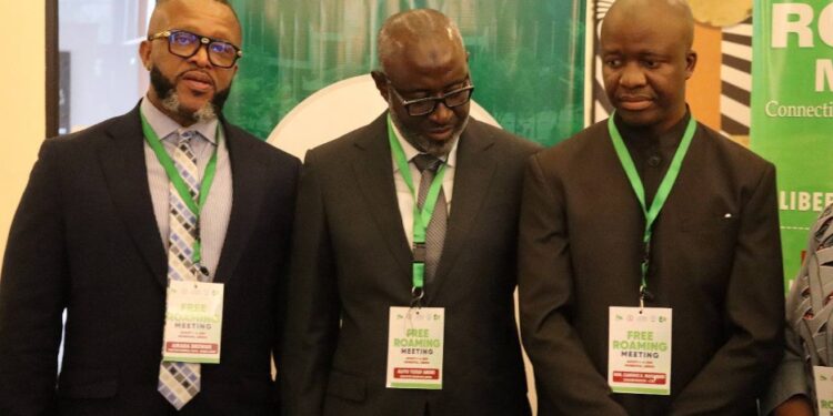 Clarence Massaquoi and West African telecom leaders pose at ECOWAS Free Roaming launch in Monrovia, highlighting regional mobile cost reforms for Liberian travelers.