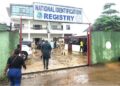 Employees and visitors enter National Identification Registry compound in Congo Town as biometric ID rollout remains stalled.
