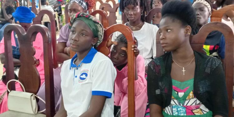 Liberian youth participate in an empowerment workshop organized by A New Day at House of Grace Parish in Monrovia to take action against the drug crisis.