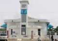 Congregants and community members gather for a tense United Methodist Church meeting amid ongoing conflict over the closure of S.T. Nagbe UMC in Monrovia, Liberia.